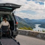 Wheelchair user entering an accessible road-trip van using a secure vehicle ramp