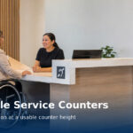 Global accessible service counter guidance showing a preferred counter height of 760 to 850 mm, minimum 900 mm accessible counter length, 900 by 1200 mm clear floor space, and wheelchair knee clearance beneath the counter.